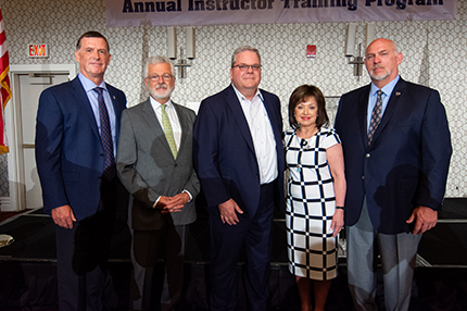 WCC President Dr. Rose B. Bellanca stands with Ironworkers representatives (from left) Lee Worley, Victor Cornellier, Eric Dean and Ed Abbott.