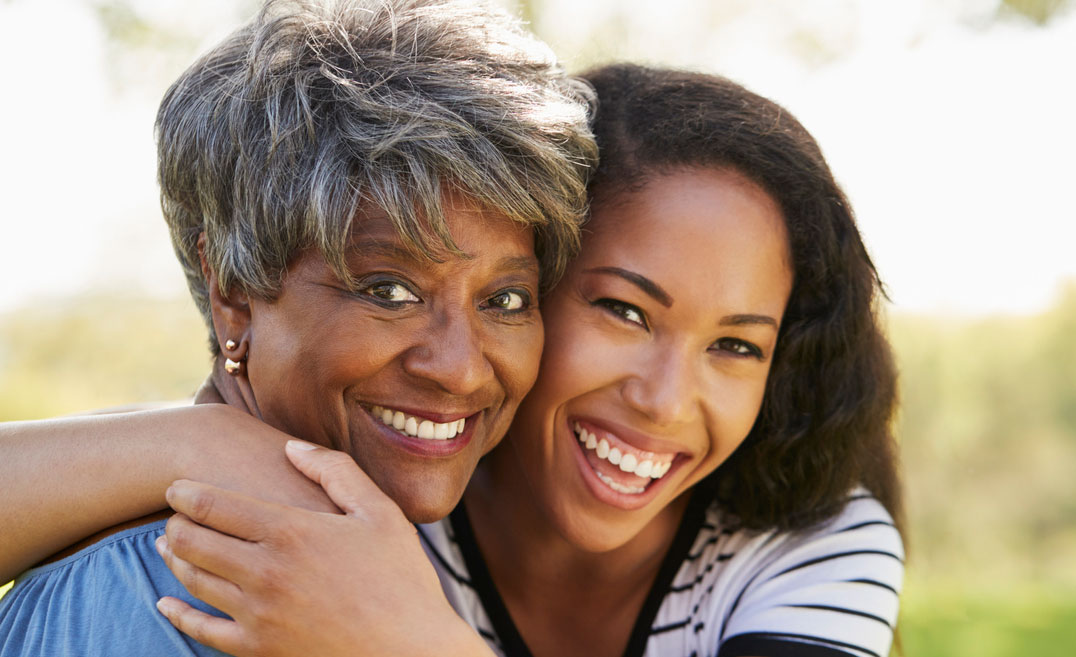 adult student hugging mother or grandmother