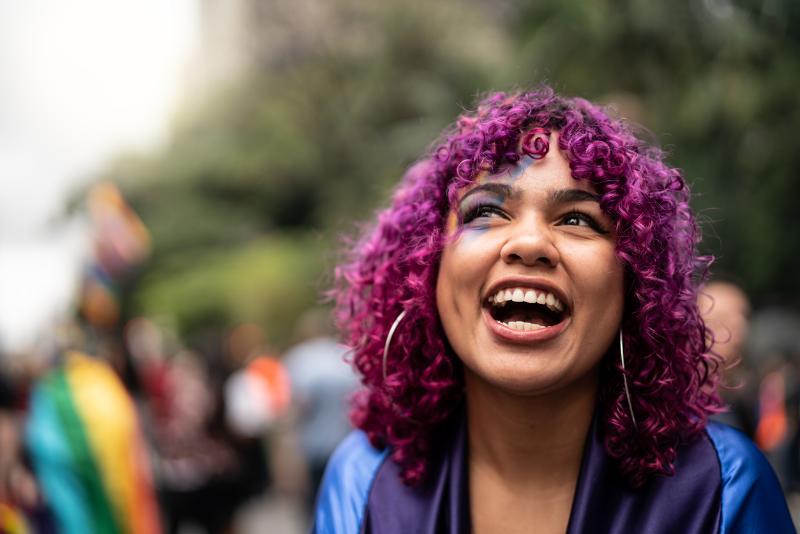 excited young person with pink hair