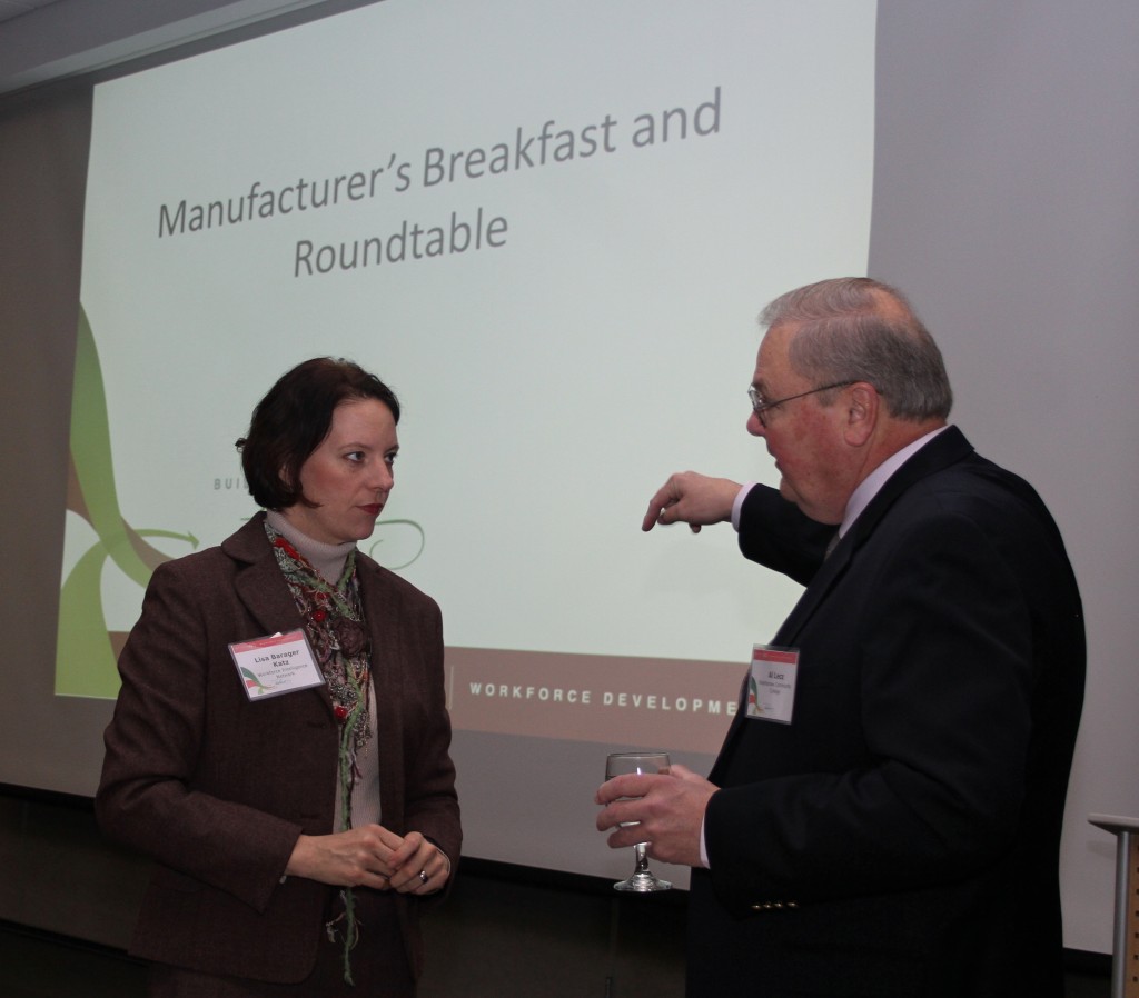 Al Lecz, director of the WCC Advanced Transportation Center, talks with Lisa Katz, executive director of Workforce Intelligent Network of Southeast Michigan. Photo by Lynn Monson