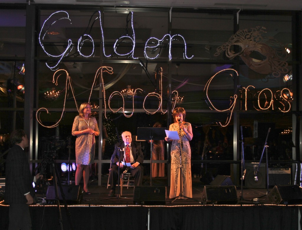 WCC President Dr. Rose B. Bellanca welcomes attendees from the Mardi Gras stage.