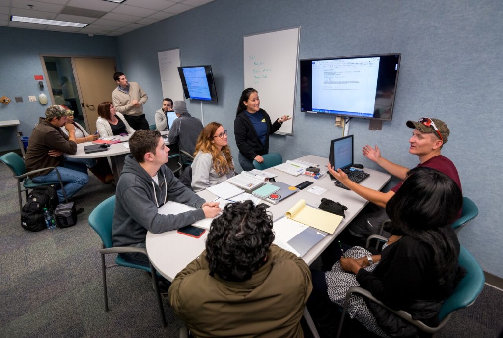 Photo By Steve Kuzma Students work on a project in Washtenaw Community College's new collaborative classroom.