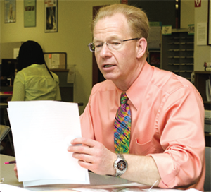 Tom Zimmerman reviews a student’s work at the WCC writing center.